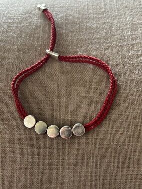 Links of London- Adjustable Red Braided Cord Bracelet with Silver Discs
